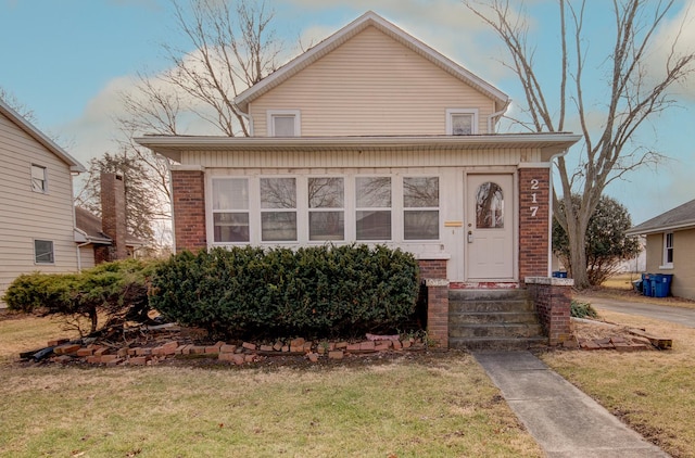 bungalow with a front yard