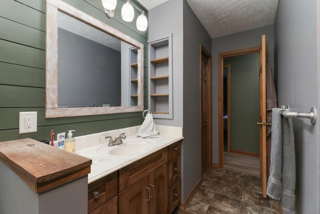 bathroom featuring vanity and a textured ceiling