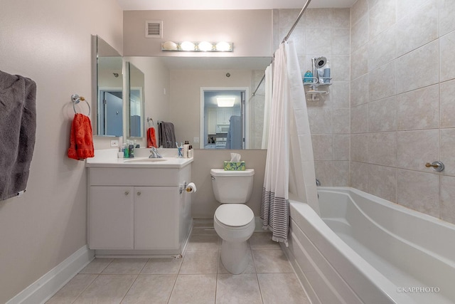 full bathroom with vanity, toilet, tile patterned flooring, and shower / tub combo