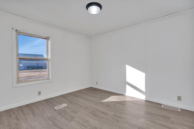 empty room with wood-type flooring