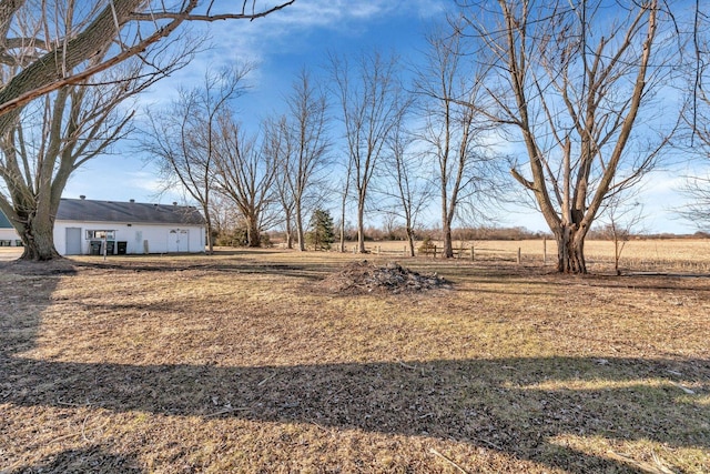 view of yard with a rural view