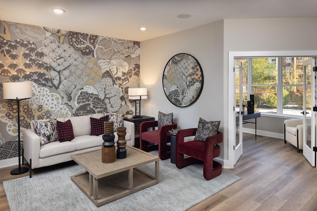 living room featuring french doors and hardwood / wood-style floors