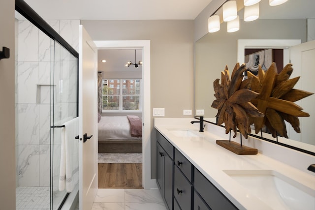 bathroom with walk in shower and vanity