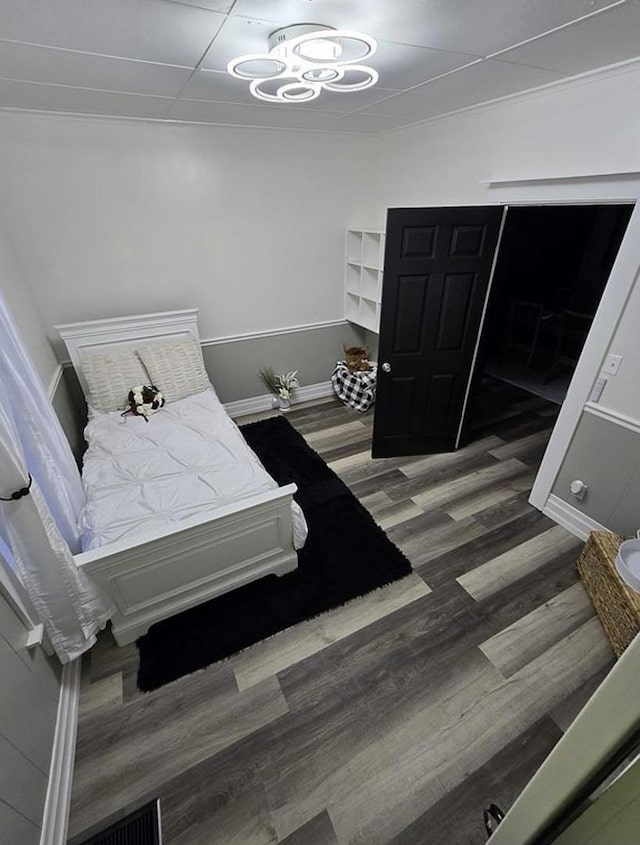 bedroom with dark hardwood / wood-style floors