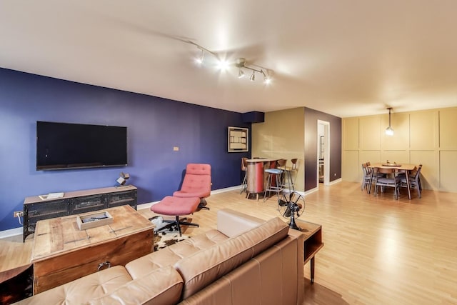 living room with wood finished floors and baseboards