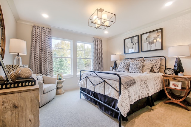 bedroom with ornamental molding, carpet flooring, and a notable chandelier