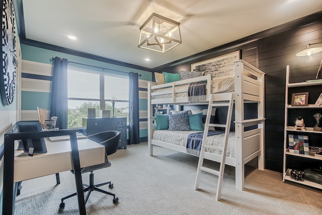 bedroom with ornamental molding and carpet flooring