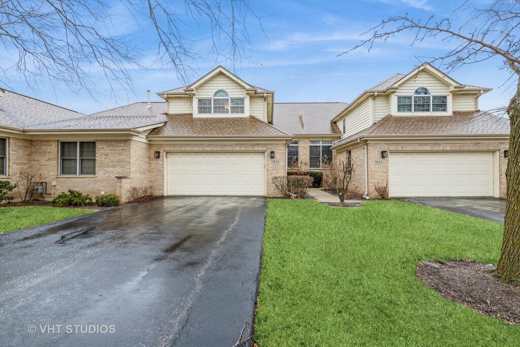 1922 Ivy Ln, Glenview, IL 60026 - view of front facade with aphalt driveway, brick siding, roof with shingles, and an attached garage