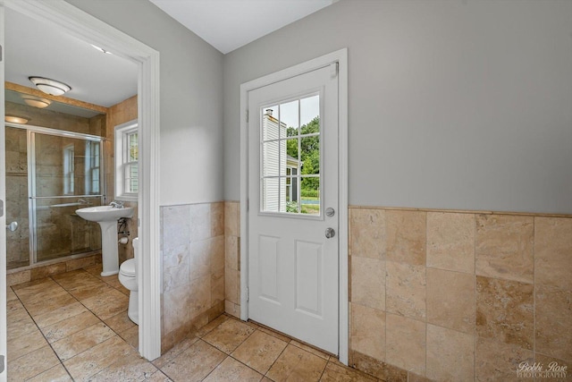 6N356 Dunham Rd, Wayne, IL 60184 - doorway to outside featuring tile walls and a wainscoted wall