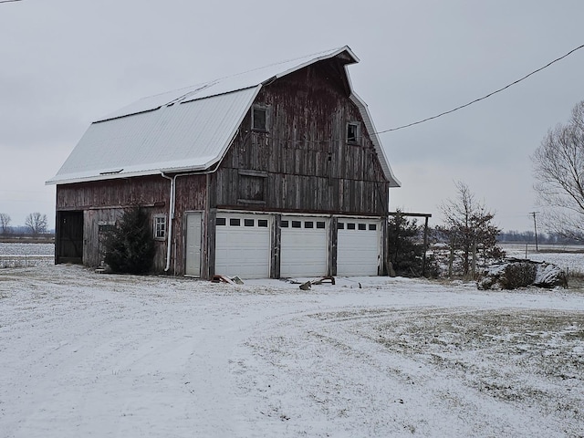 view of snow covered garage