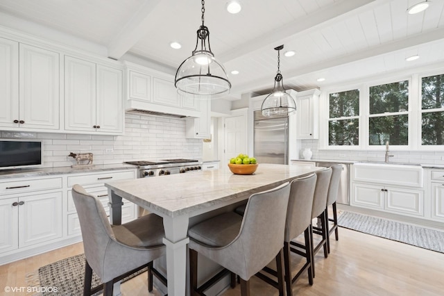 kitchen featuring a center island and white cabinets