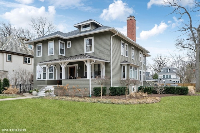 view of front of home featuring a front lawn and covered porch