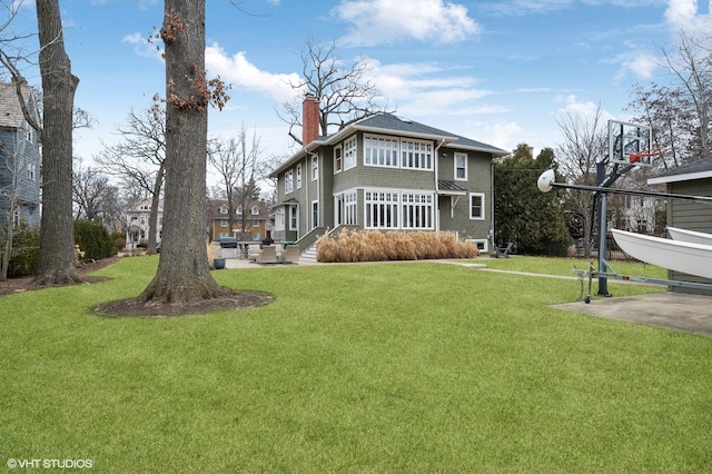 back of house featuring a yard