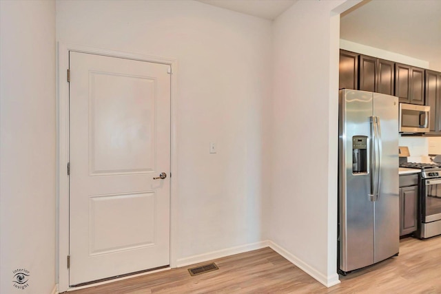 kitchen featuring light hardwood / wood-style flooring and appliances with stainless steel finishes