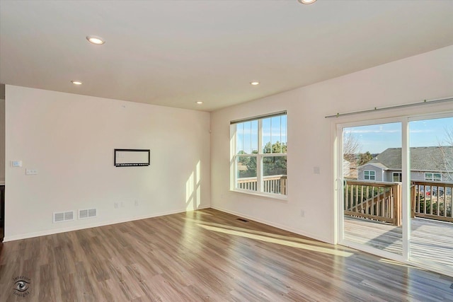 empty room with wood-type flooring