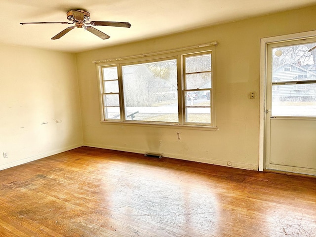 unfurnished room with ceiling fan and light hardwood / wood-style floors