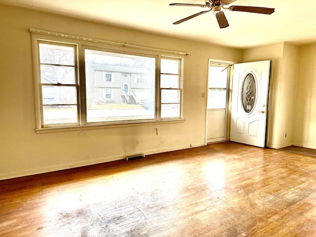 entryway with light hardwood / wood-style floors and ceiling fan