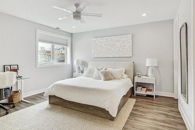 bedroom featuring recessed lighting, baseboards, and wood finished floors