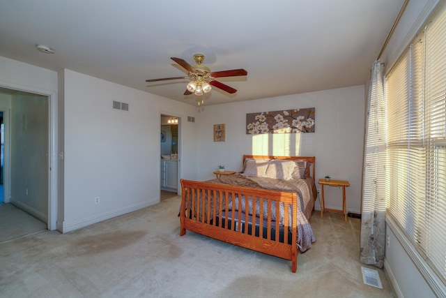 bedroom with light carpet and ceiling fan