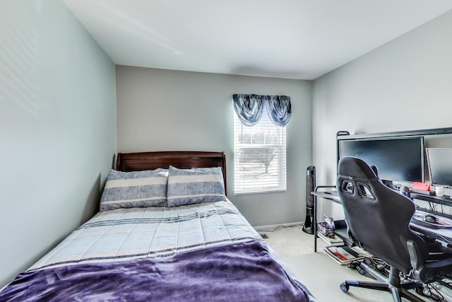 carpeted bedroom with baseboards