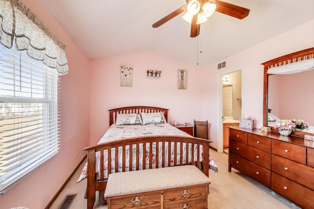 bedroom with light colored carpet, lofted ceiling, visible vents, and ceiling fan