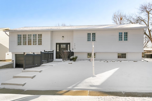 raised ranch featuring a garage