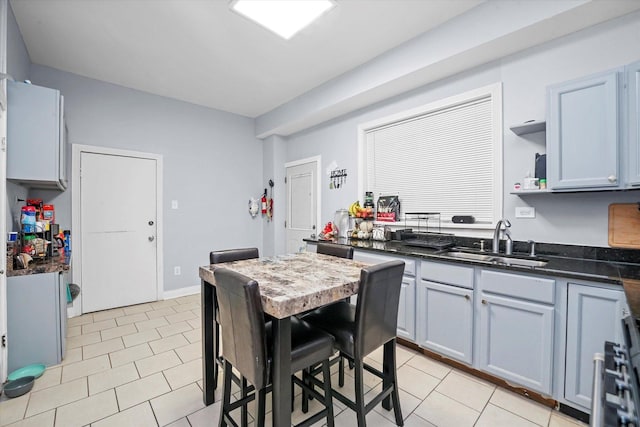 kitchen with sink and light tile patterned floors