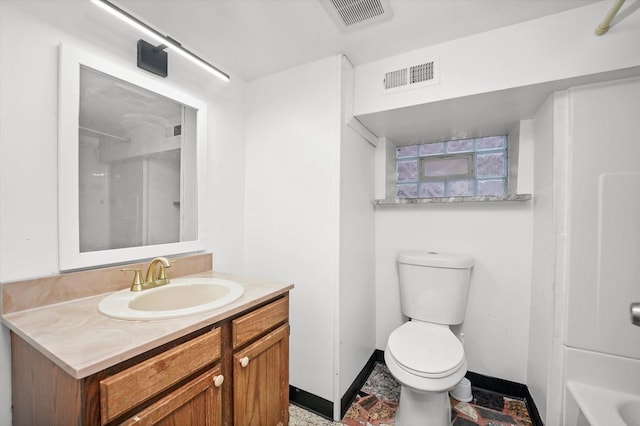 bathroom with vanity and toilet