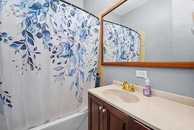 bathroom featuring vanity and shower / tub combo with curtain