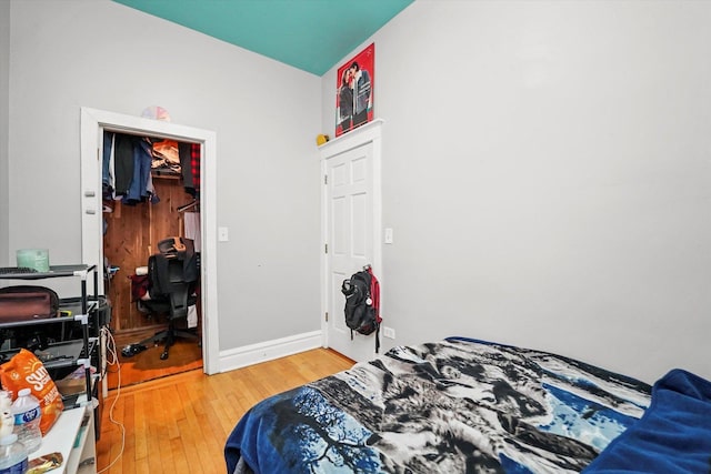 bedroom with hardwood / wood-style floors