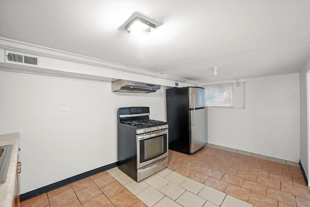 kitchen featuring appliances with stainless steel finishes and light tile patterned floors