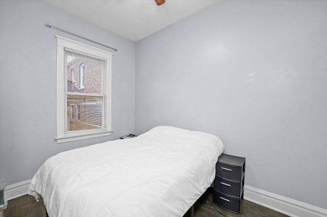 bedroom with dark wood-type flooring and ceiling fan