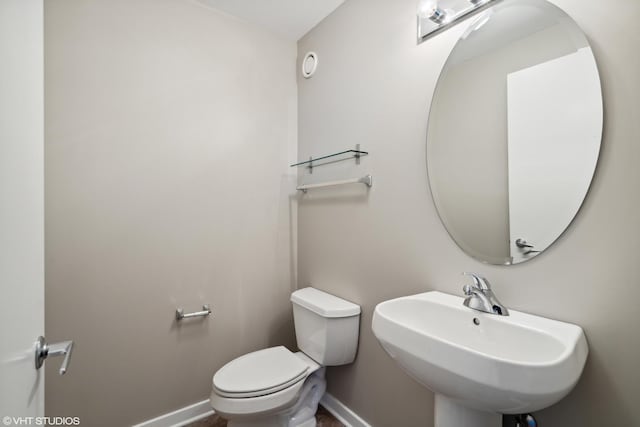 bathroom with sink and toilet