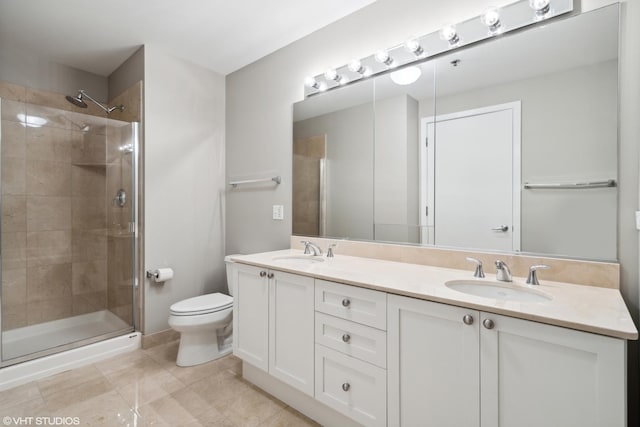 bathroom featuring an enclosed shower, vanity, tile patterned floors, and toilet