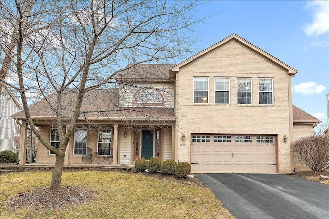 view of front of house featuring a garage and a front yard