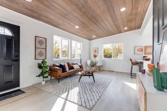 living area with wood ceiling, vaulted ceiling, and light hardwood / wood-style flooring