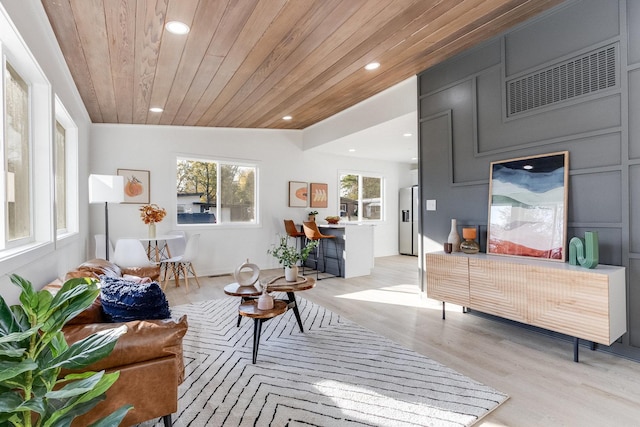 interior space with wood ceiling and light hardwood / wood-style flooring