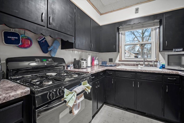 kitchen with black gas range and sink