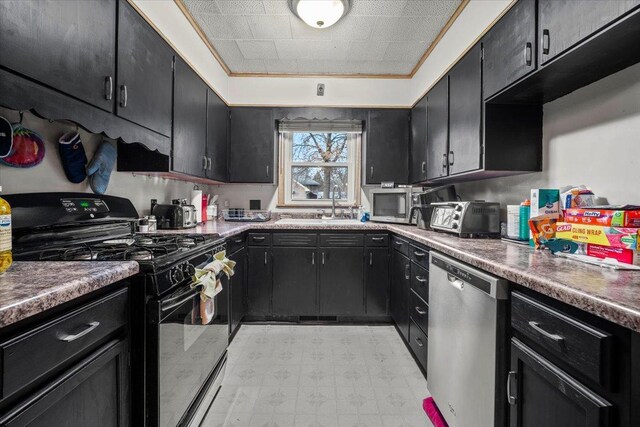 kitchen featuring sink, stainless steel dishwasher, and black gas range