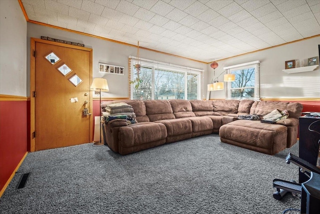 carpeted living room with ornamental molding