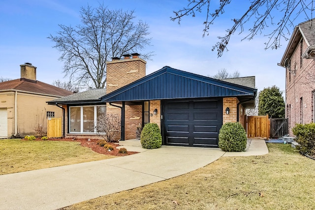 ranch-style house featuring a garage and a front yard