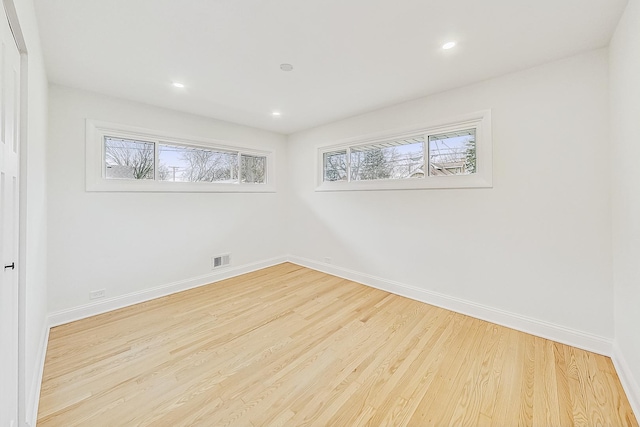 spare room with light hardwood / wood-style floors