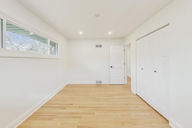 interior space featuring light hardwood / wood-style floors and a closet