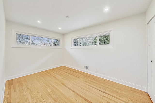 unfurnished room featuring light hardwood / wood-style floors