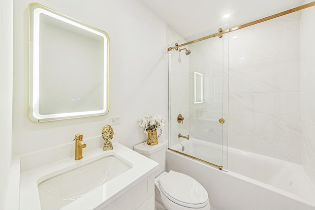 full bathroom with vanity, shower / bath combination with glass door, and toilet