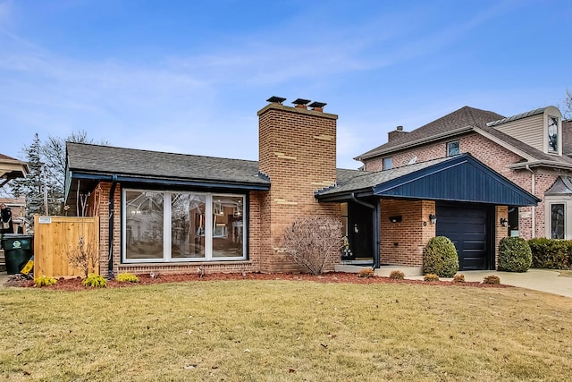 view of front of property with a garage and a front lawn