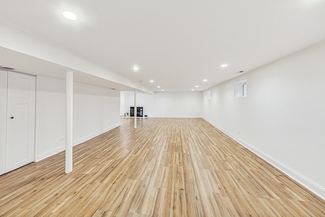 basement featuring light hardwood / wood-style flooring