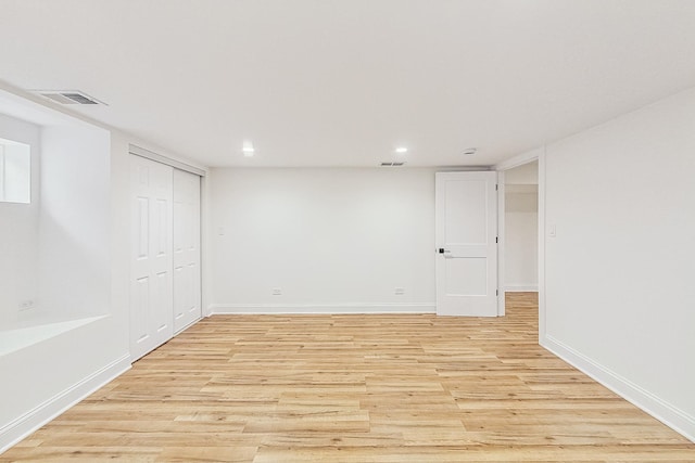 basement featuring light wood-type flooring