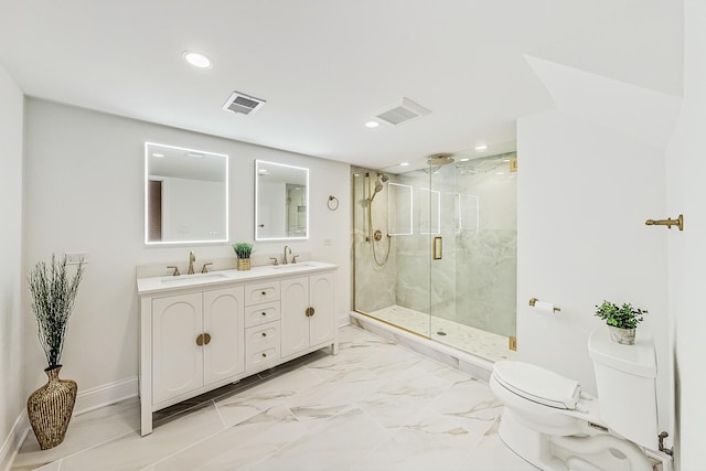 bathroom with vanity, toilet, and a shower with shower door