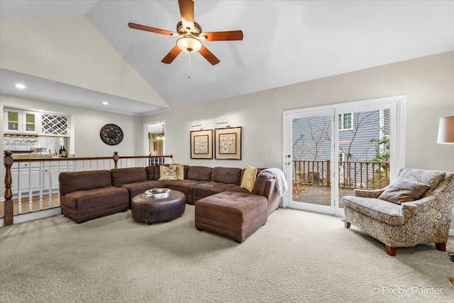 living area featuring high vaulted ceiling, recessed lighting, light colored carpet, and ceiling fan